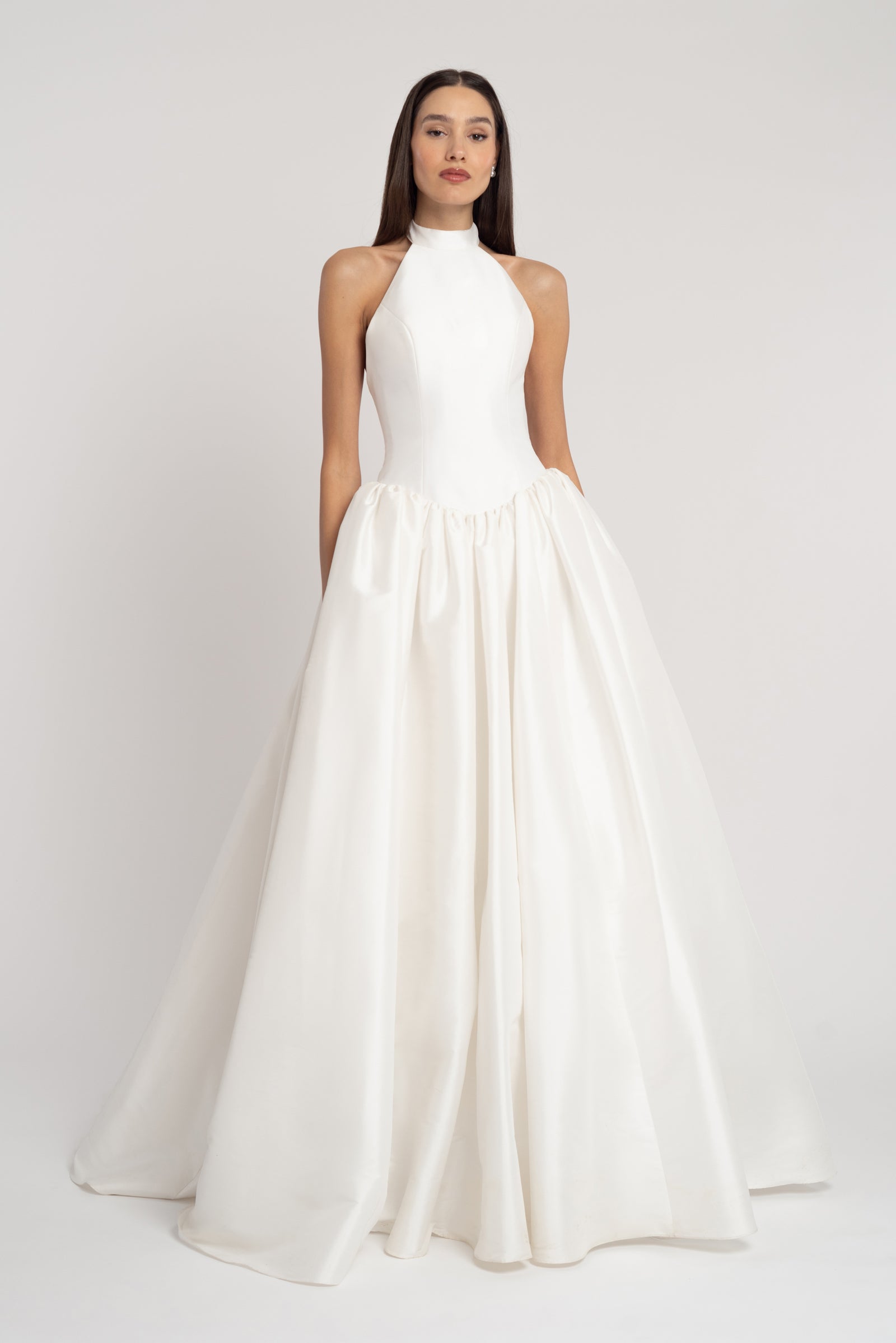Blake High neck halter wedding dress with open back and basque drop waist skirt.