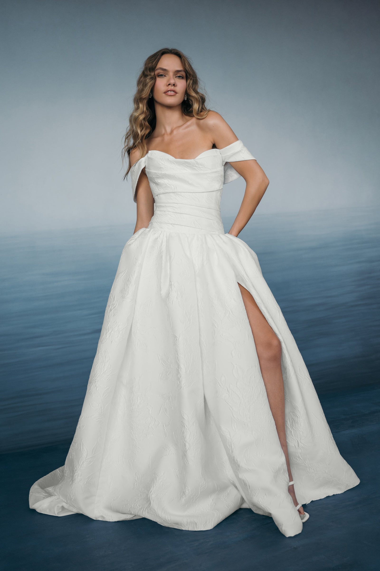 Crawford jacquard floral wedding dress with removable off shoulder sleeves and drop waist A-Line skirt.