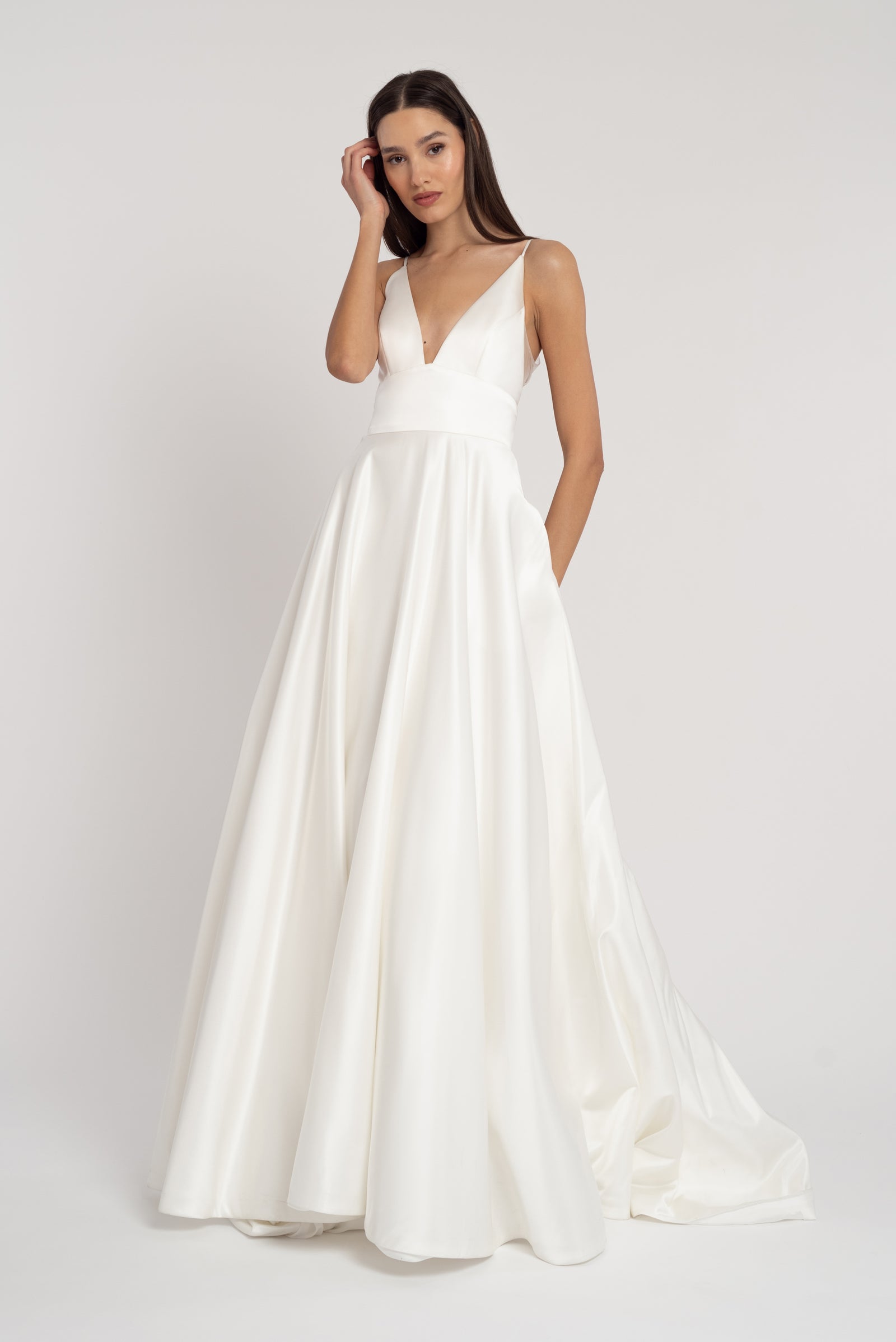 Thin strap A-Line V Neck wedding dress on model.