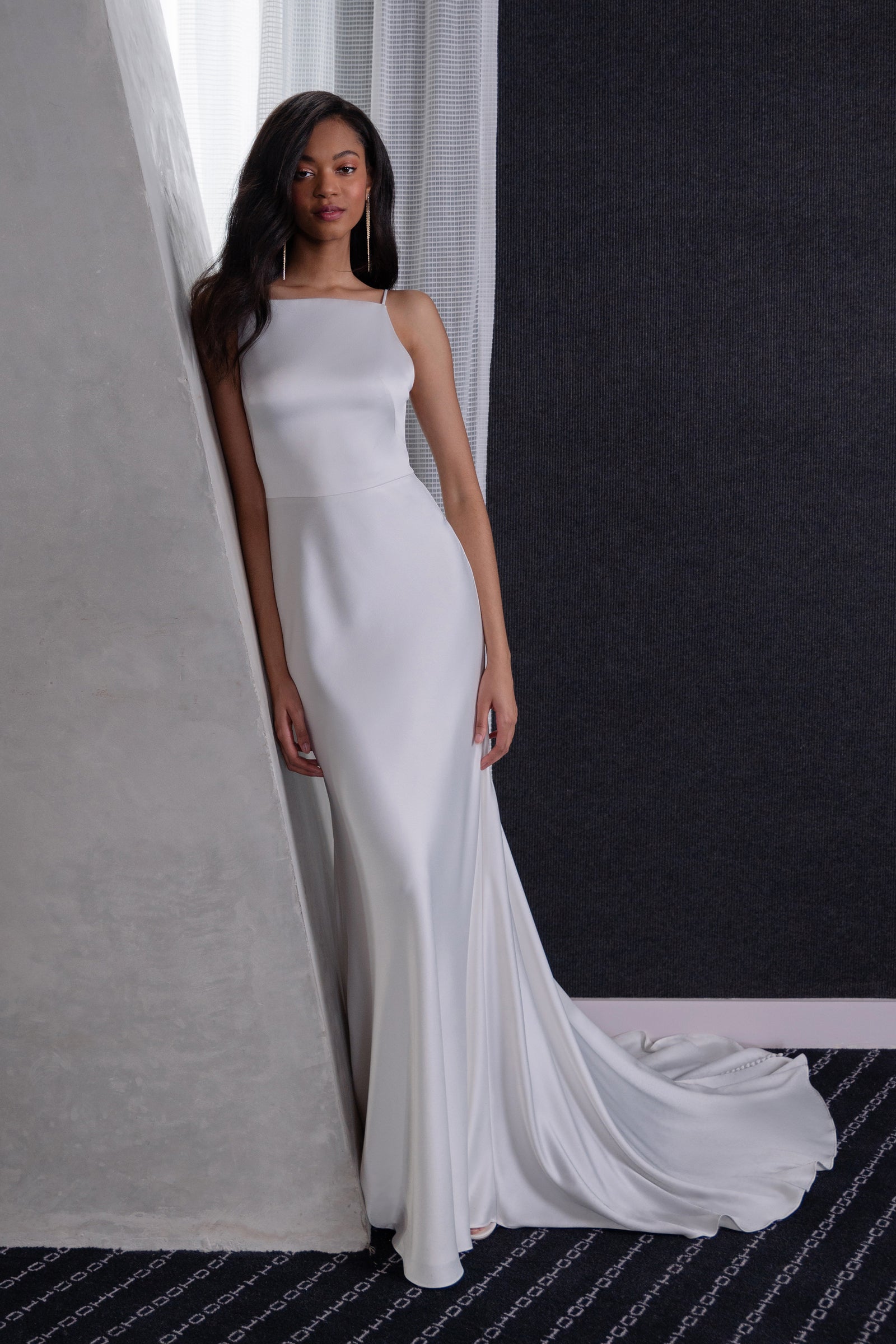 Jamie high neck natural waist and fit and flare bridal gown on model.
