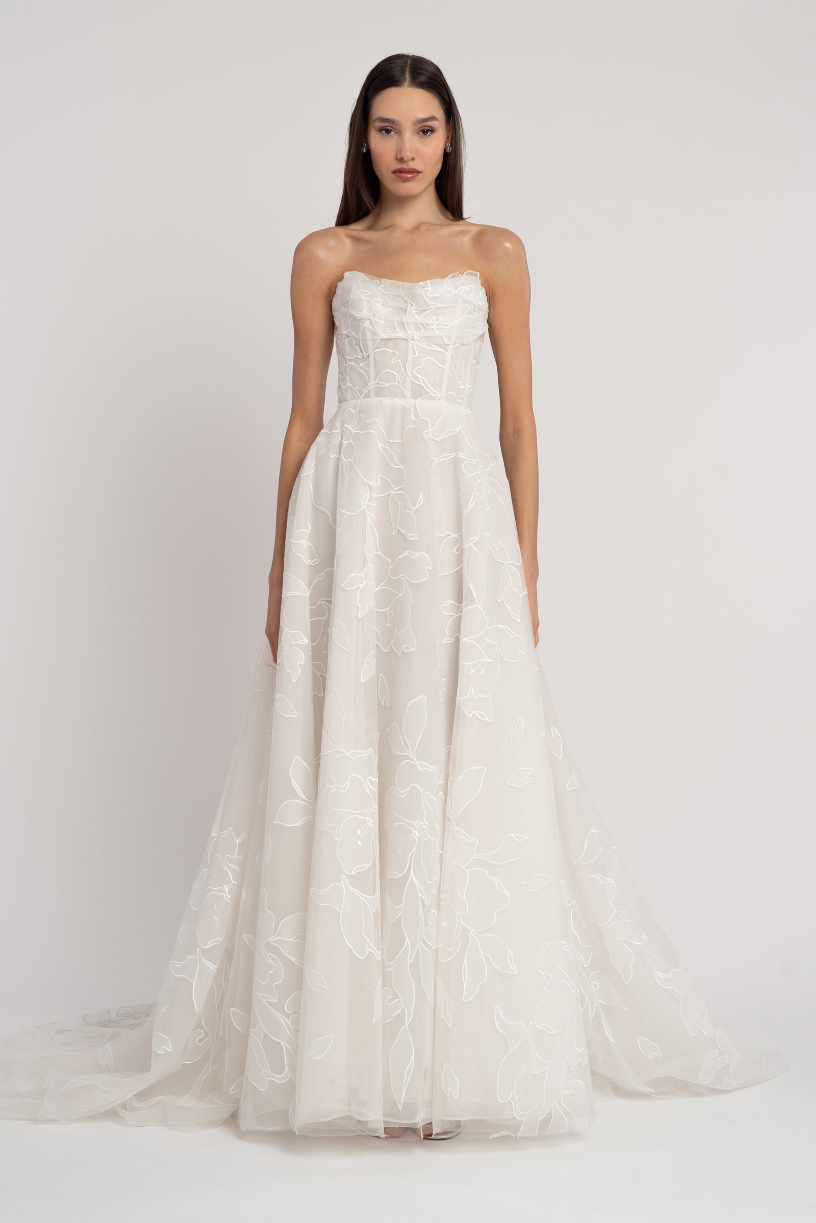 Strapless draped and boned bodice wedding dress with A-Line silhouette.