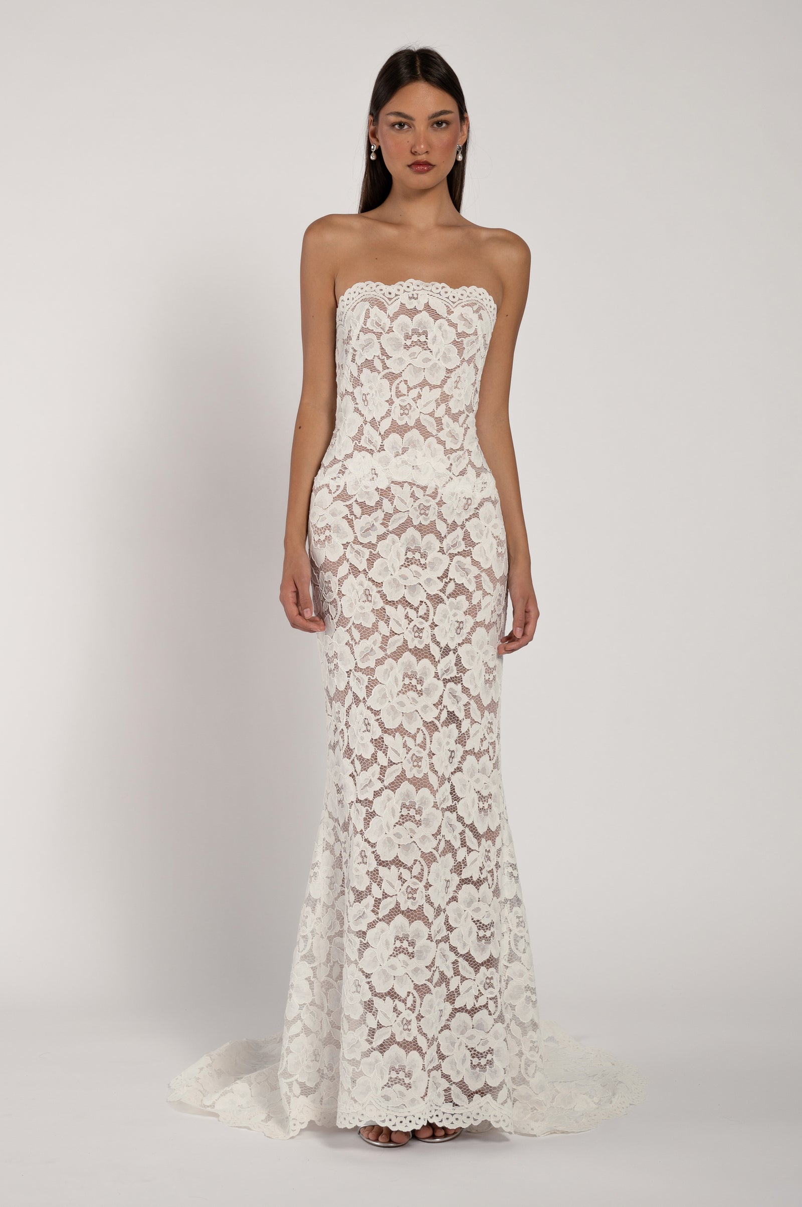 Strapless lace fit and flare bridal gown with nude undertone.