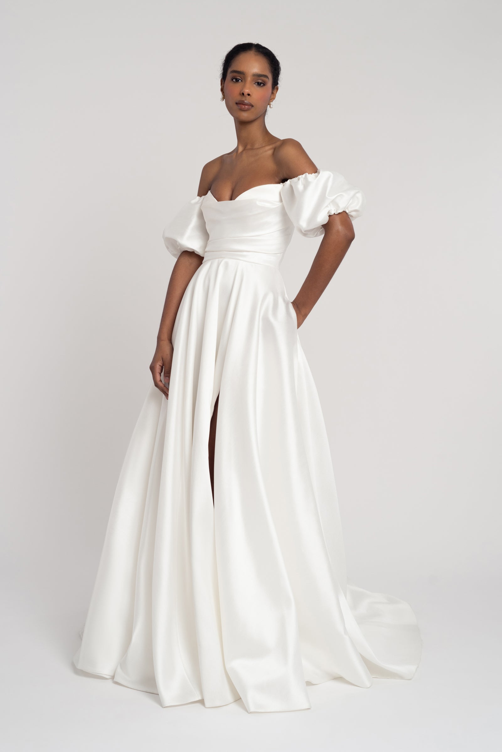 Marisol off shoulder wedding dress with a-line skirt and removable pull sleeves.
