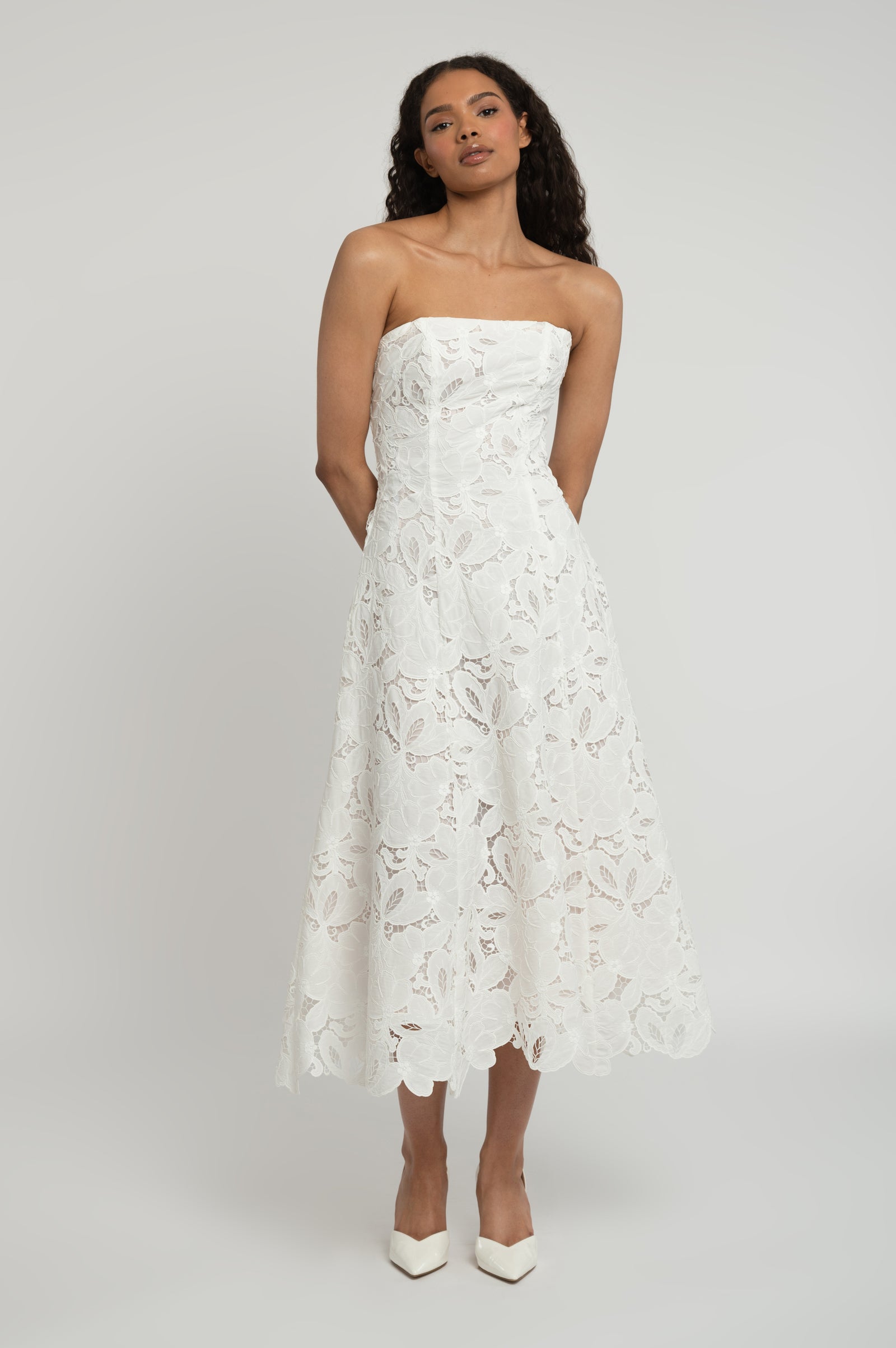 Frida classic bridal dress with strapless neckline and a-line skirt in lace.