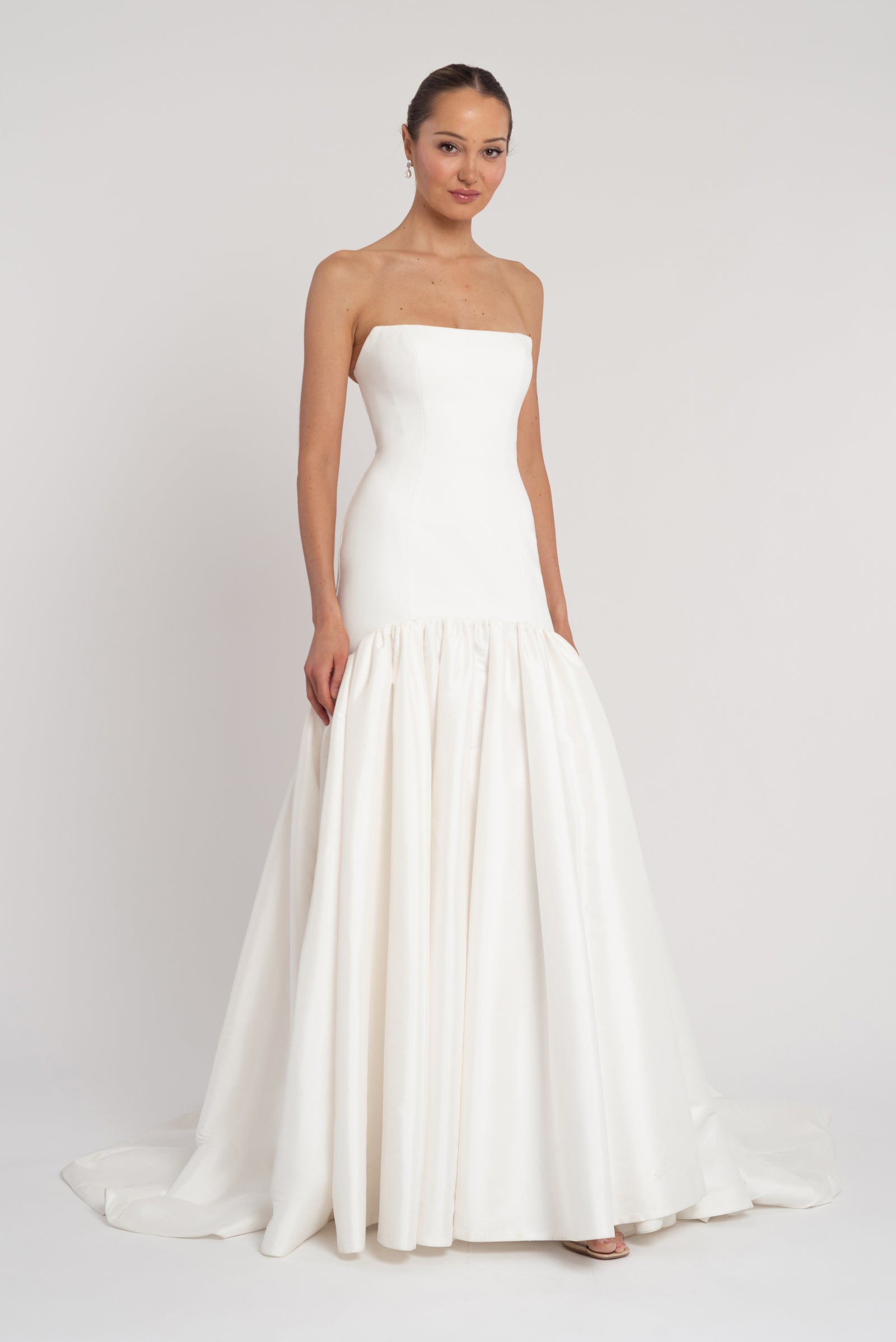 Sienna strapless minimalist fit and flare wedding dress.