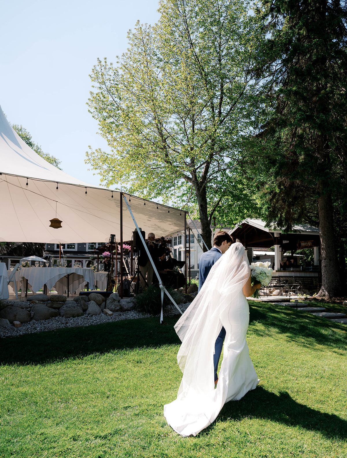 Real Bride Kate in the Timeless Tricia Strapless fit and flare wedding dress with floral applique.
