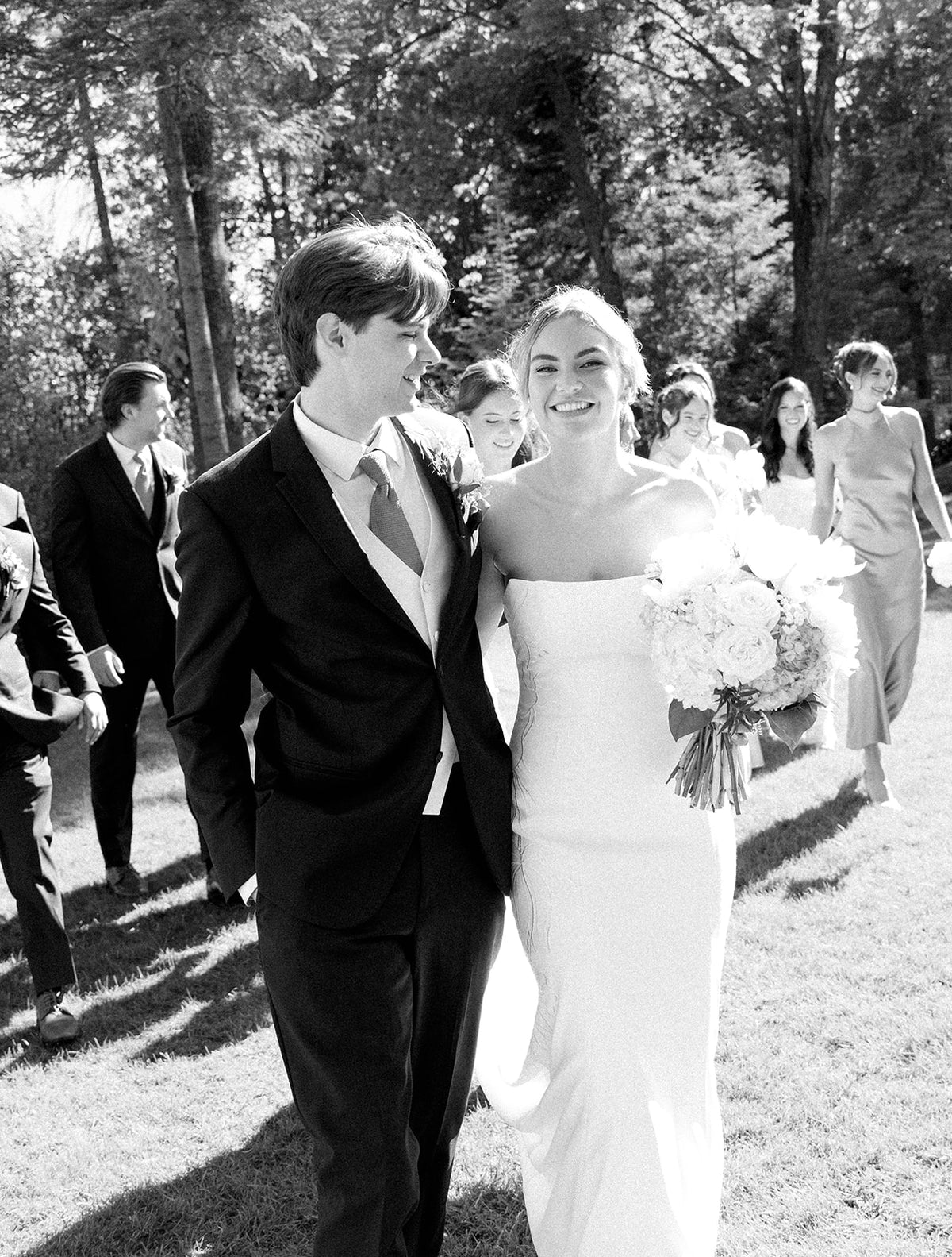Real Bride Kate in the Timeless Tricia Strapless fit and flare wedding dress with floral applique.