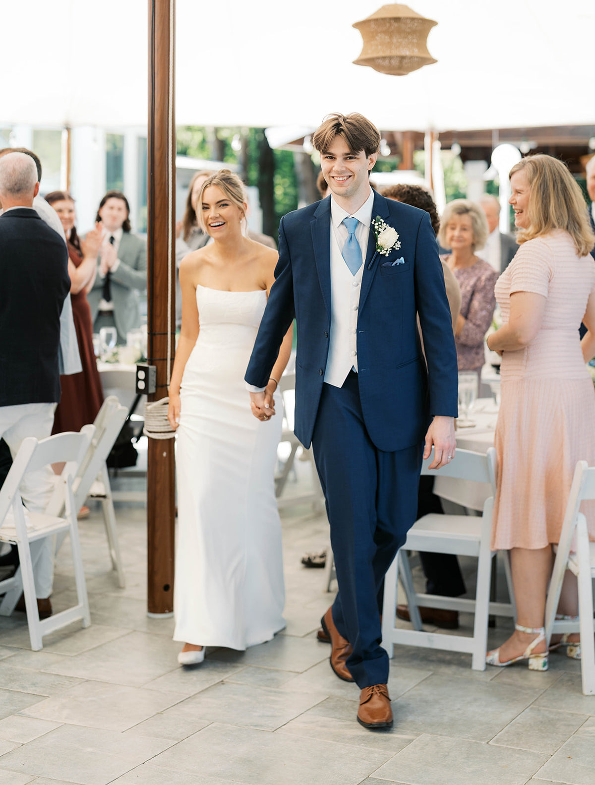 Real Bride Kate in the Timeless Tricia Strapless fit and flare wedding dress with floral applique.