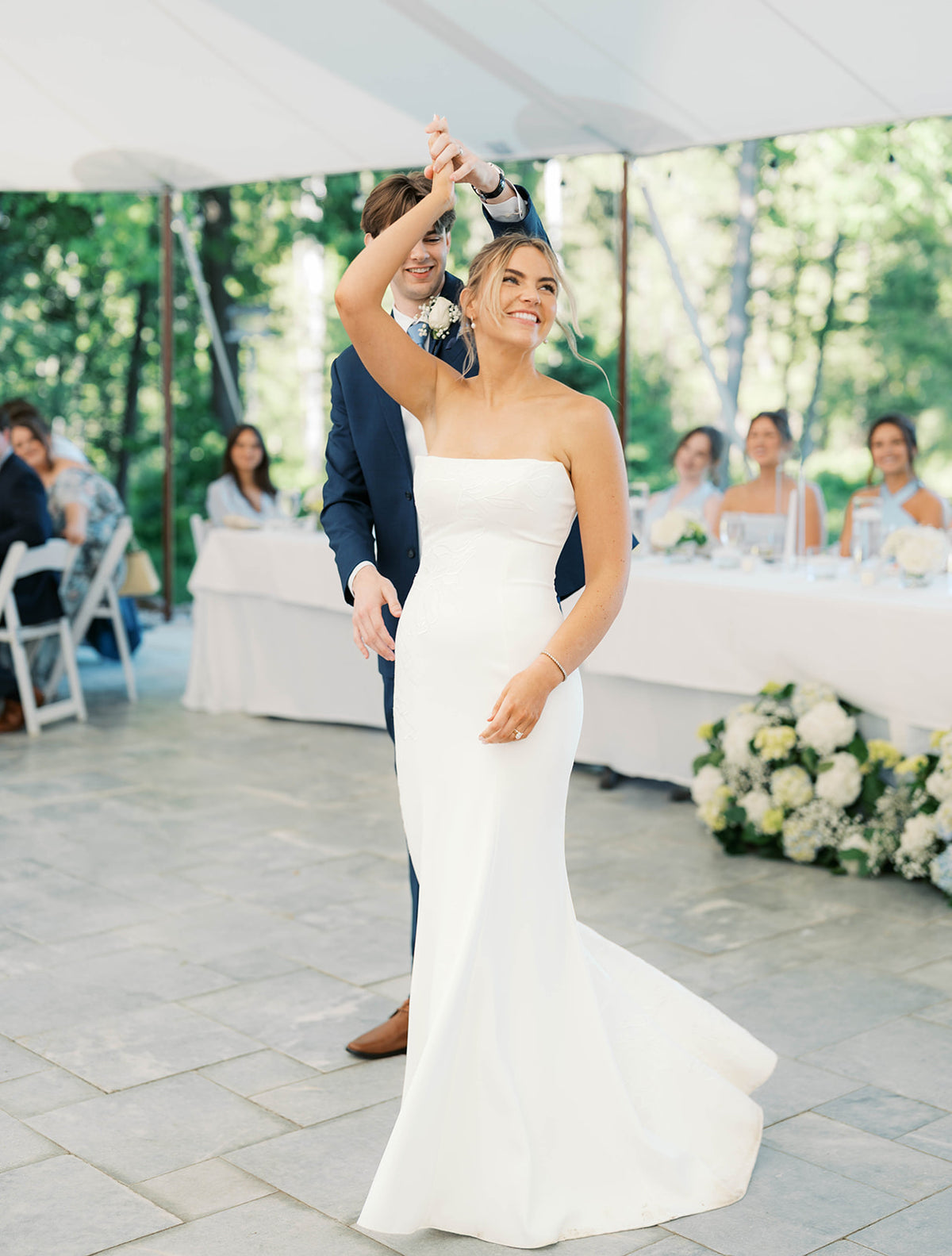 Real Bride Kate in the Timeless Tricia Strapless fit and flare wedding dress with floral applique.
