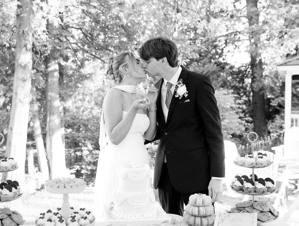 Real Bride Kate in the Timeless Tricia Strapless fit and flare wedding dress with floral applique.